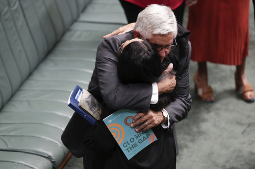 The Minister for Indigenous Australians, Ken Wyatt, embraces Labor’s Linda Burney after the Prime Minister’s Closing the Gap statement to Parliament in February last year. 