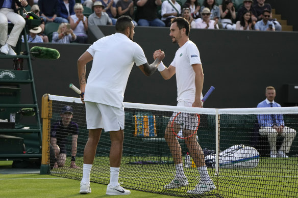 Nick Kyrgios shakes hands with Italy’s Gianluca Mager after their match.