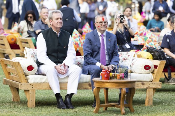 Barry O’Farrell and Anthony Albanese view a performance during the Holi celebration in India in March.