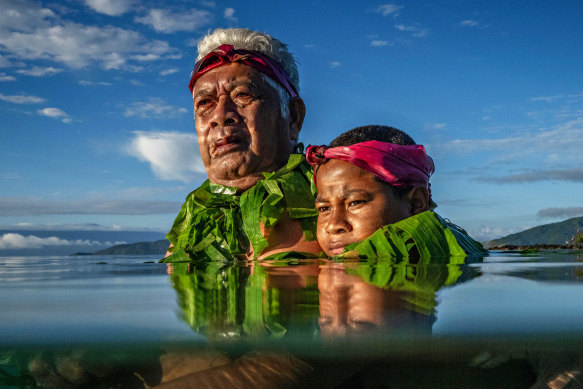 Eddie Jim’s award-winning photograph of Lotomau Fiafia and his grandson John, who are residents of Fiji’s Kioa Island, in August 2023.