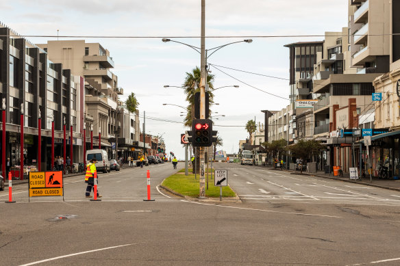 A general view of Bay Street in Port Melbourne, one of several shopping strips and centres flagged by health authorities. 