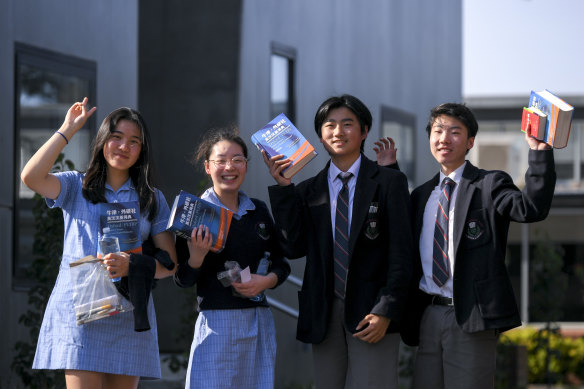 Students at McKinnon Secondary College celebrate the completion of their Chinese VCE exam on Wednesday. From left: Cindy Mao, Amanda Wu, Kun Liu and Henry Zhou.