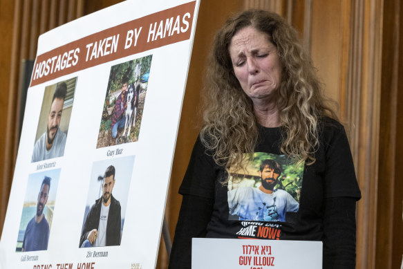 Doris Liber, whose son Guy Iluz is being held hostage in Gaza, holds in her emotions during a press conference with House Republicans at the Capitol