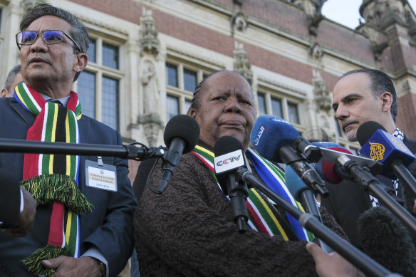 South Africa’s Foreign Minister Naledi Pandor, centre, addresses reporters after the World Court session.