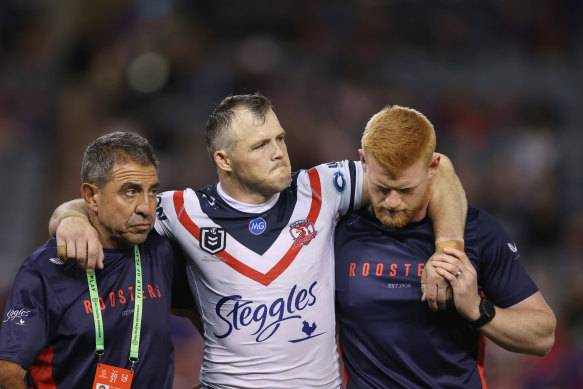 Brett Morris hobbles off the field during a game against the Knights in May.