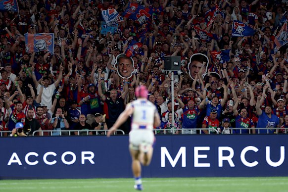 Knights supporters cheer Ponga on.