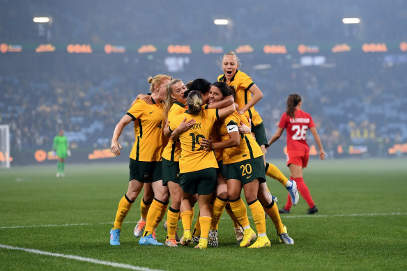 The Matildas celebrate after scoring a goal against Canada in an exhibition match at Allianz Stadium in September 2022.