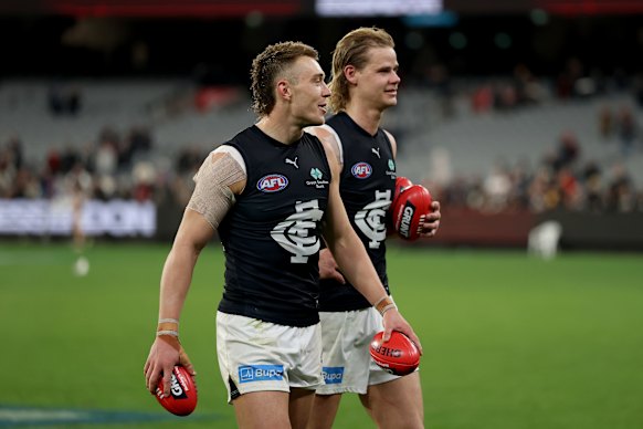 Patrick Cripps and Tom De Koning of the Blues celebrate after beating the Bombers.