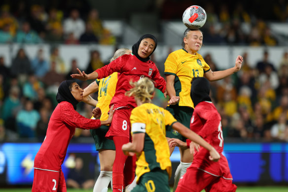 Amy Sayer heads the ball against Iran.