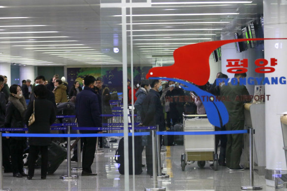 Passengers line up to check in for a flight to Vladivostok at the Pyongyang International Airport earlier this month.