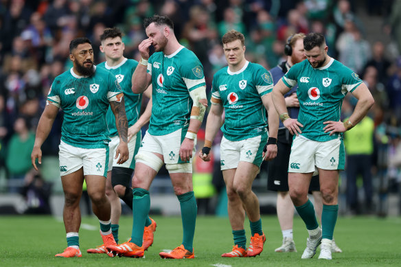 James Ryan and his Irish teammates look dejected following the team’s defeat by France.