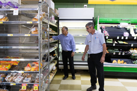 Small towns are also running out of stock due to coronavirus panic buying. Cobar IGA owner Robert Khan, left, and manager, Matt Carey.