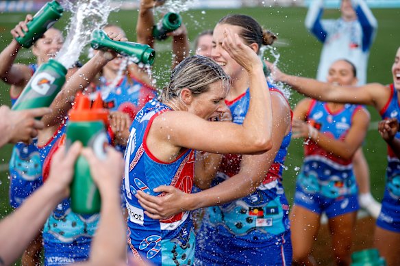 Elle Bennetts of the Bulldogs enjoys the win with teammates.