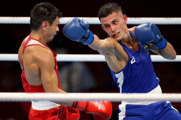 Harry Garside exchanges punches with Zakir Safiullin during his quarter-final in Tokyo. 