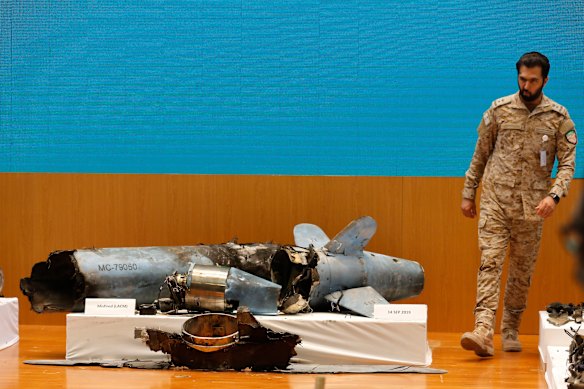 A Saudi military officer walks next to what was described as a misfired Iranian cruise missile.