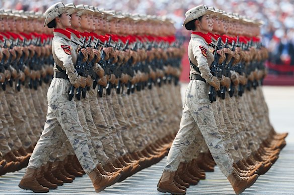 Soldiers march during a parade marking the 80th anniversary of WWII’s end in Tiananmen Square on September 3.