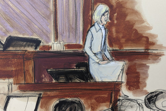 A courtroom sketch as E Jean Carroll stands with one leg up to show the jury how she was able to push Donald Trump off her during the alleged assault, and escape from the dressing room.