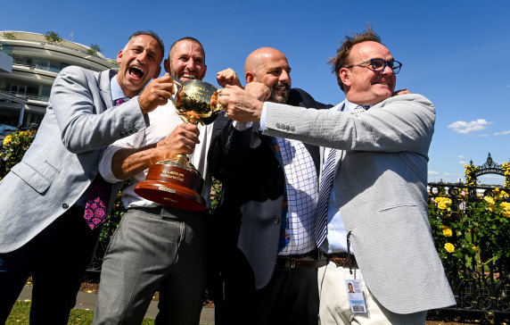 Racing’s gang of four celebrate their Melbourne Cup win. 