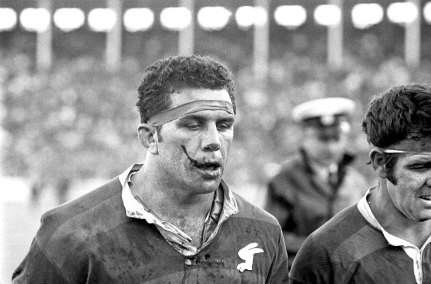 Souths captain John Sattler leaves the field after having his jaw broken and teeth smashed during altercation early in the Grand Final with Manly front row forward John Bucknall, 1970.