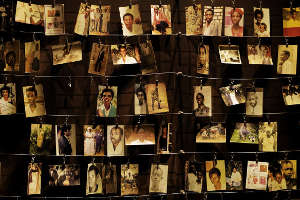 Family photographs of some of those who died in the genocide hang on display in an exhibition at the Kigali Genocide Memorial centre in Rwanda. 