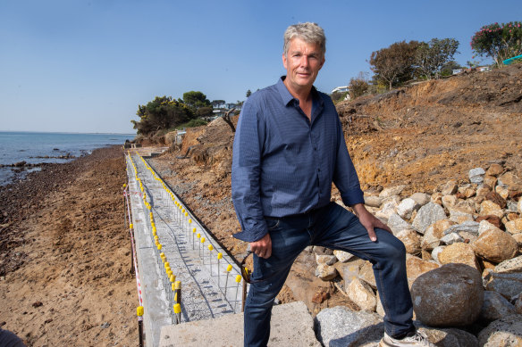 Gene Neill in front of the sea wall in March.