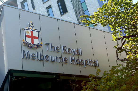 Hundreds of staff have been furloughed amid an outbreak at Royal Melbourne Hospital. 