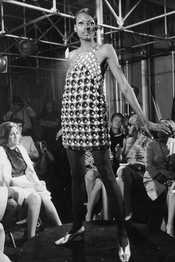 A mini dress made of lacquered aluminium discs designed by Paco Rabanne.  