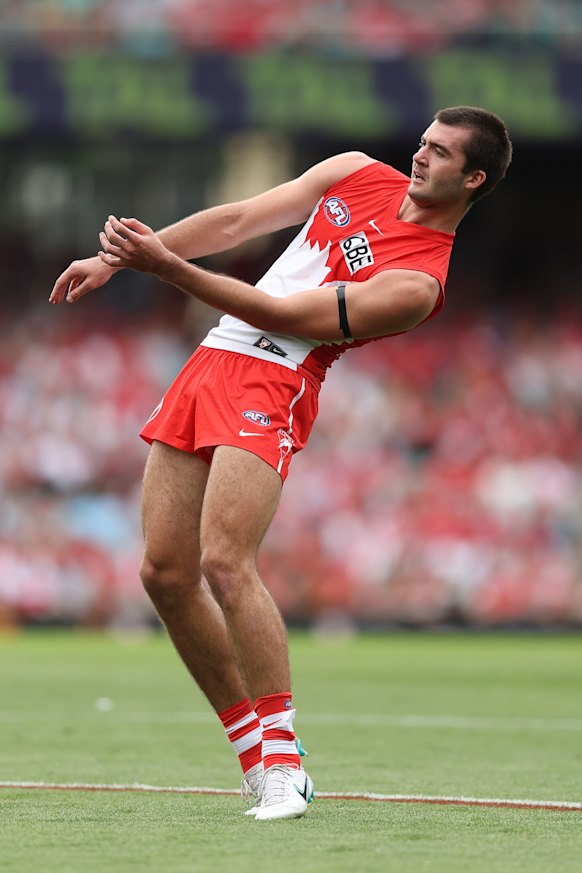 Logan McDonald, five goals, rides ones of his shots on goal home against Hawthorn.