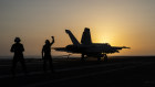 A fighter jet lands on the USS Dwight D. Eisenhower in the Red Sea.