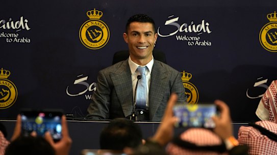 Cristiano Ronaldo smiles during a press conference for his official unveiling as a new member of Al Nassr soccer club in in Riyadh.