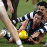 Travis Boak of the Power wins the ball.