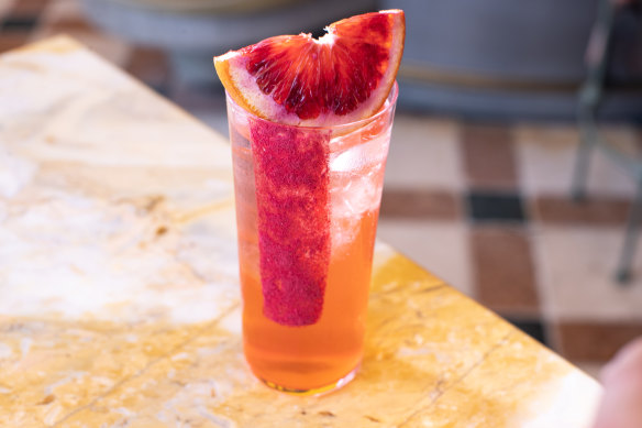 HER Rooftop’s version of the Paloma, made with blood orange.