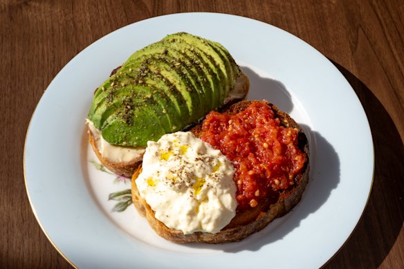 Avocado (and tahini) on toast comes with an extra slice topped with tomato pulp and stracciatella cheese.