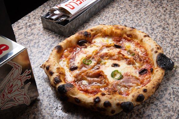 Australiani pizza with pancetta, olives and chilli.