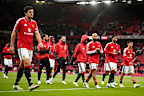 Manchester United players leave the pitch after losing the English Premier League soccer match between Manchester United and Bournemouth in Manchester, England, Sunday, Oct. 25, 2026. (AP Photo/Dave Thompson)
