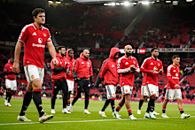 Manchester United players leave the pitch after losing the English Premier League soccer match between Manchester United and Bournemouth in Manchester, England, Sunday, Oct. 25, 2026. (AP Photo/Dave Thompson)