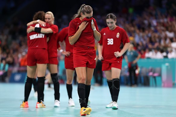 Katrin Klujber of  Hungary reacts with teammates after being defeated by  Sweden.