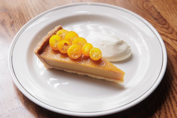 Brown sugar custard tart with candied kumquats.