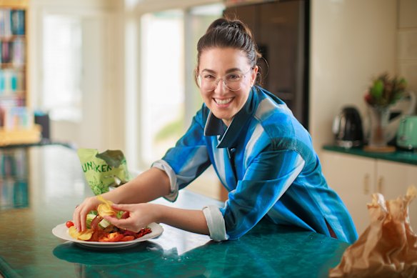 Alice prepares a picky plate in her home kitchen.