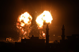 Flames are seen after an Israeli air strike hit Hamas targets in Gaza City, breaking a ceasefire agreed last month.