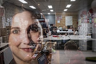 Carina Garland (foreground) is Labor’s candidate for Chisholm. Inside her office on Wednesday night, volunteers were making calls to voters in the seat.