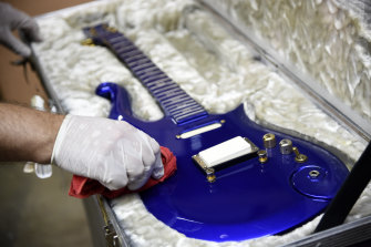 The “Blue Angel” Cloud 2 electric guitar custom-made for Prince in the 1980s is polished at Julien's Auctions warehouse ahead of the auction. 