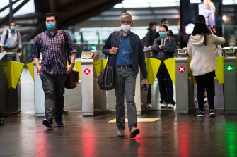 Workers returning to the Melbourne CBD made their way through Southern Cross Station on Monday morning. 