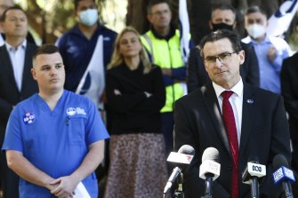 NSW Nurses and Midwives’ Association general secretary Brett Holmes with hospital emergency department nurse Josh who was diagnosed with COVID-19 and received workers’ compensation cover without having to prove he was infected at work.
