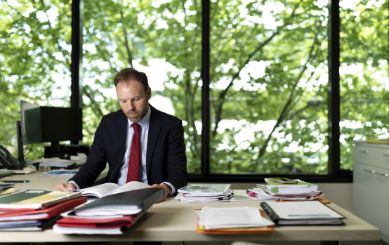 Michael Brennan in his office at the Productivity Commission believes improving productivity required boosting the capacity and wellbeing of the workforce.