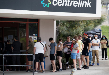 JobKeeper was introduced at the height of the coronavirus pandemic as people losing their jobs queued outside Centrelink.