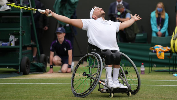 Dylan Alcott celebrates his Wimbledon victory.