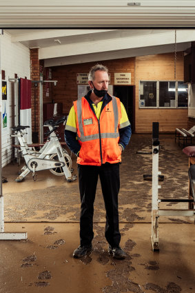 Traralgon Football Netball Club president Kevin Foley surveys the damage to the clubrooms from the recent floods.