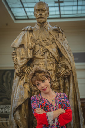 Not happy George: Author Kathy Lette next to the King George V statue at Old Parliament House. She is on a campaign to get more women immortalised as statues #onedaymyplinthwillcome