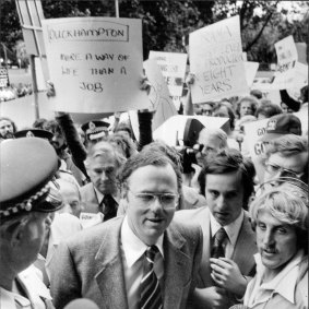 The Minister for Post and Telecommunications Tony Staley is ushered through demonstrators at the ABC.